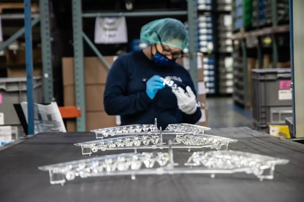 Automotive Lighting Injection Molding 1 Mass production of transparent plastic parts for car lights by injection molding