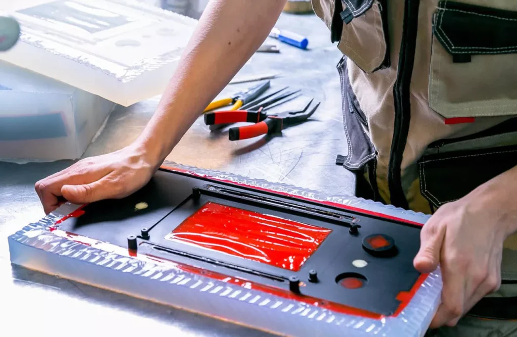 Engineers disassembling plastic parts made using silicone polyurethane casting1