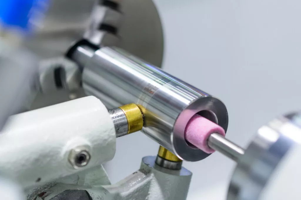 Internal grinding of precision metal parts