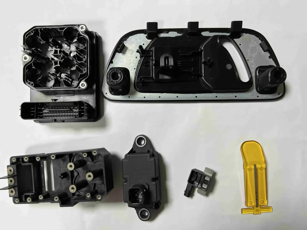 Insert molding applications for large scale manufacturing