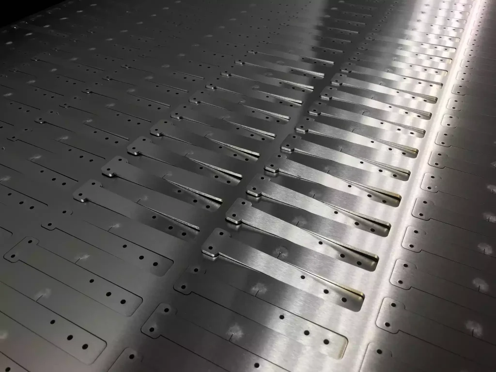 Laser cutting of small precision parts in large quantities