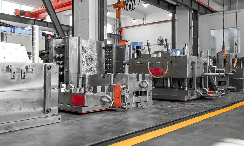 Injection molds neatly arranged in Elimold mold assembly workshop