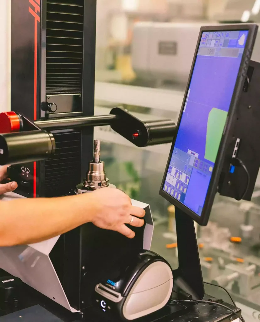 Elimold employees are operating the presetter